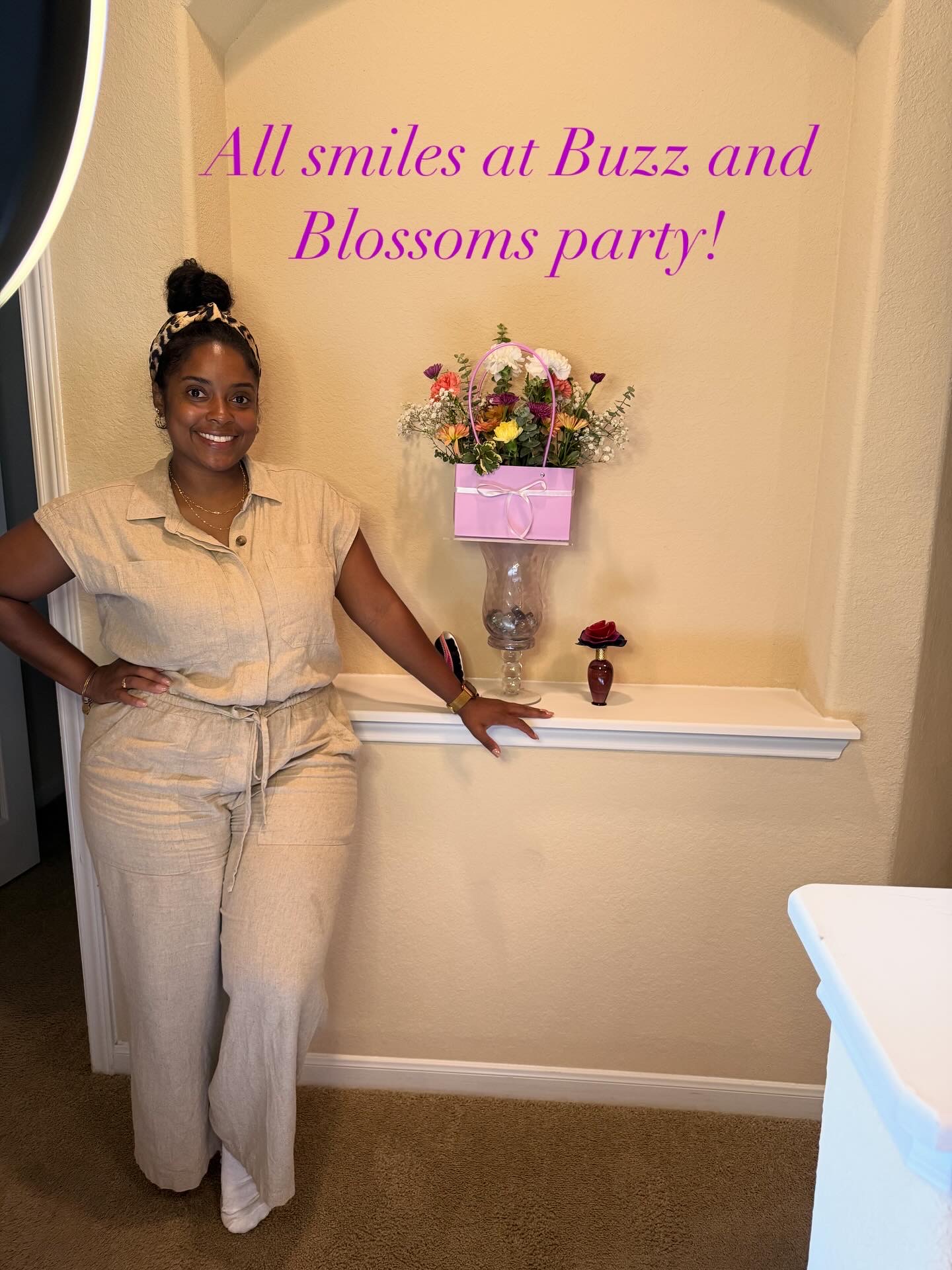 Smiling guest beside her pink bloom bag purse arrangement at a girls' afternoon brunch