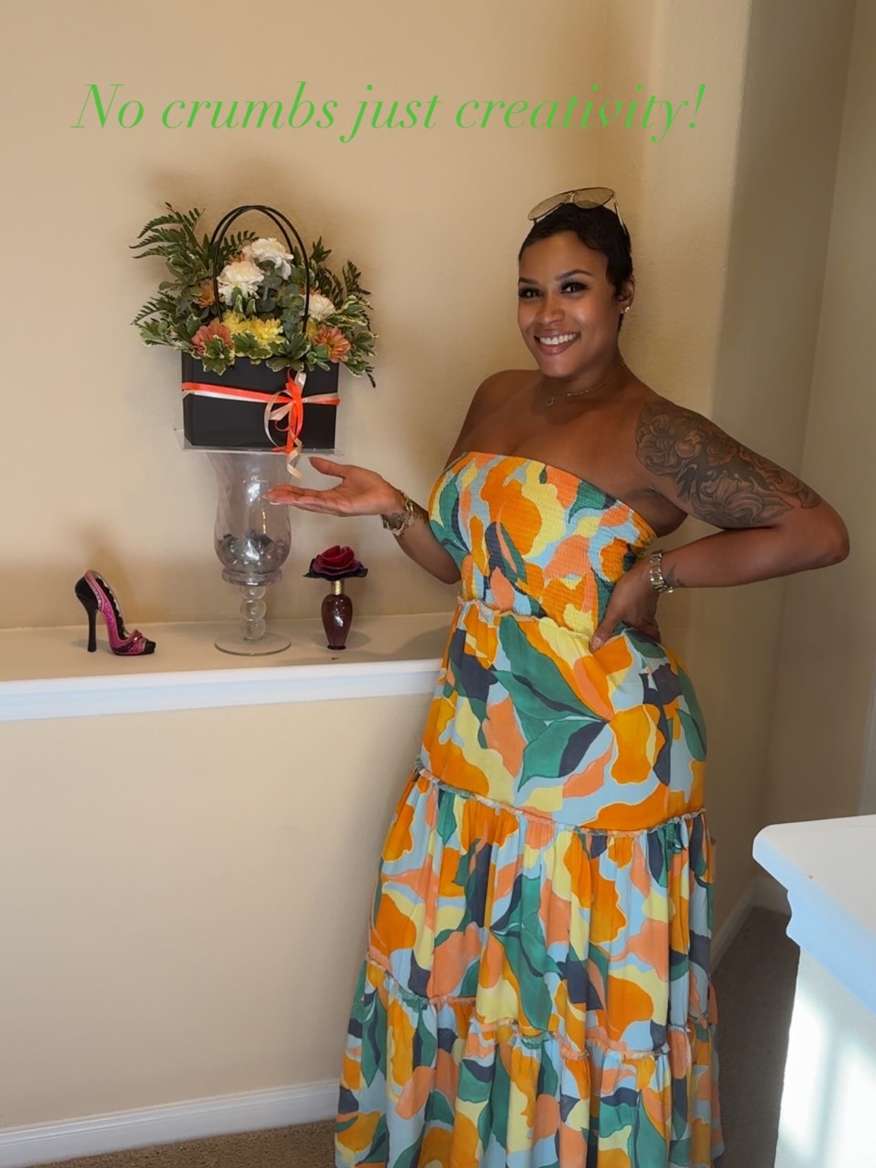 Guest presenting a black bloom bag purse filled with white and orange blooms at a girls' afternoon brunch