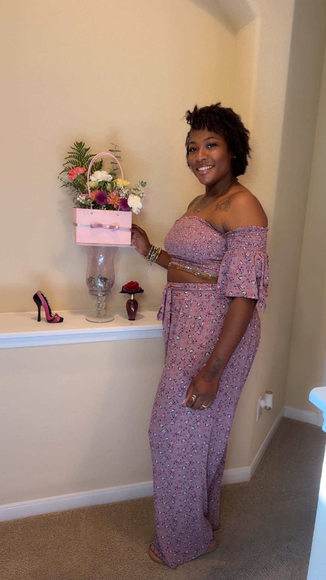Guest showcasing a blush pink bloom bag purse with carnations and greenery at a girls' afternoon brunch